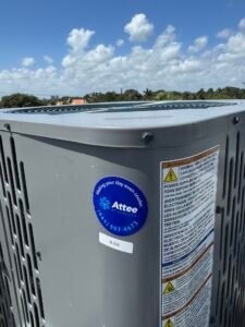 Alternate view of a rooftop HVAC unit with identification sticker applied