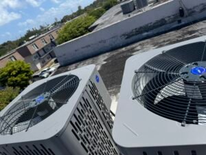 Rooftop HVAC units labeled with identification stickers by Attee AC Services